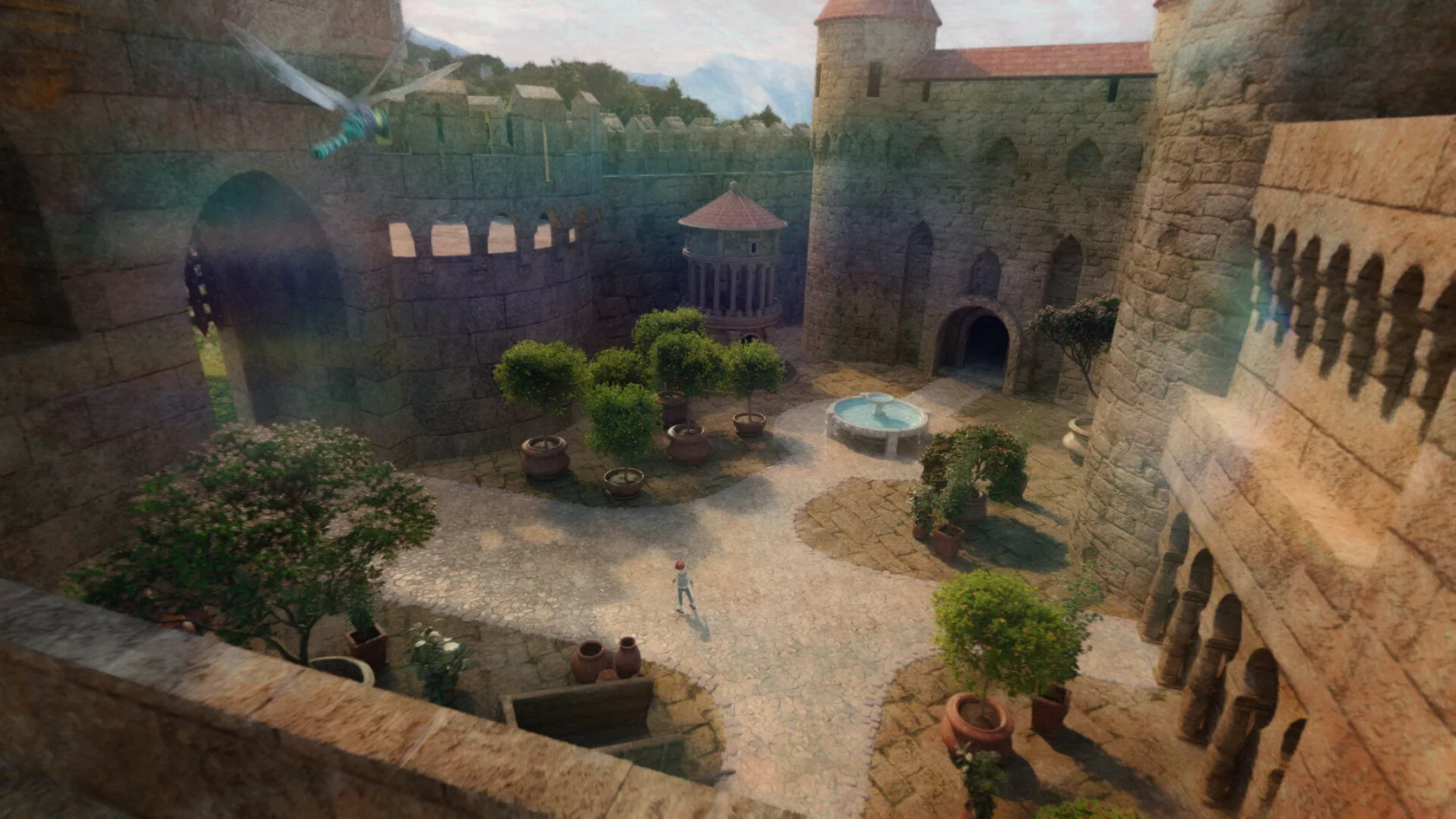 A tiny figure stands inside a sunlit castle courtyard.